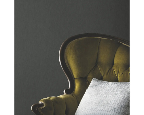 Detailopname van een fauteuil met bekleding en kussen