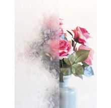 Raamfolie met glasmotief en daarachter bloemen in een vaas