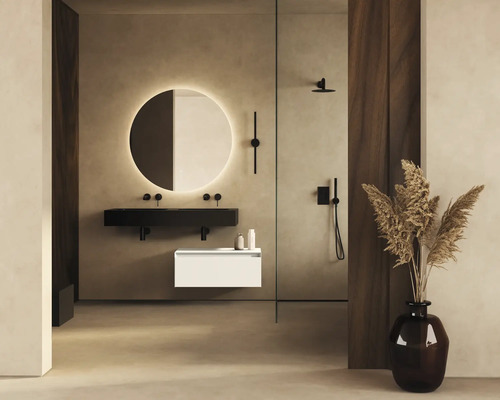Badkamer met verlichte spiegel, wastafelonderkast en douche.