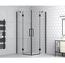 Douchecabine met zwart frame in een badkamer