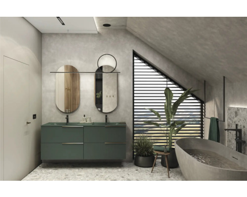 Badkamer met groene wastafel, twee spiegels en ligbad