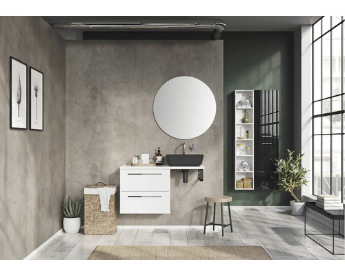 Moderne badkamer met wastafel, ronde spiegel en witte meubels.