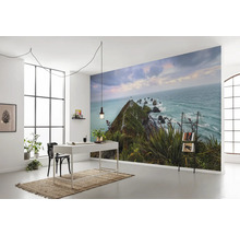 Lichte werkkamer met fotobehang van een kustlandschap met vuurtoren