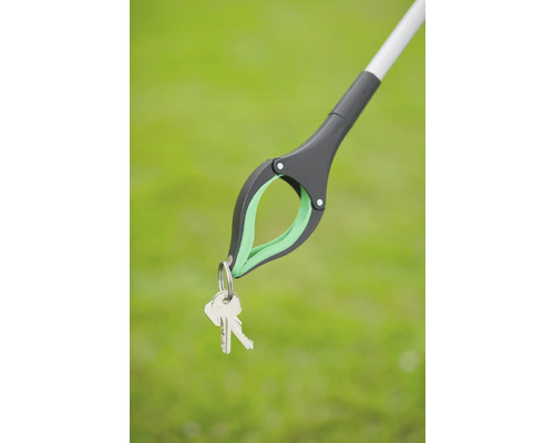 Grijptang houdt een sleutelbos vast