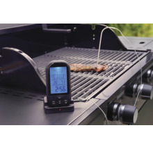 Digitale barbecue thermometer met gaarheidsindicator op een barbecue