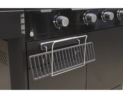 Detail van een barbecue met warmhoudrek