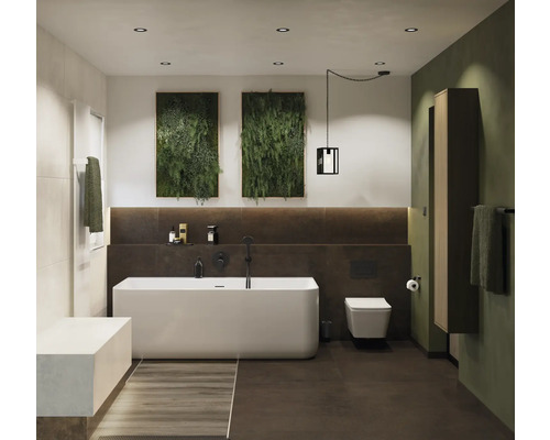 Badkamer met ligbad, toilet, wastafel en wanddecoratie met planten