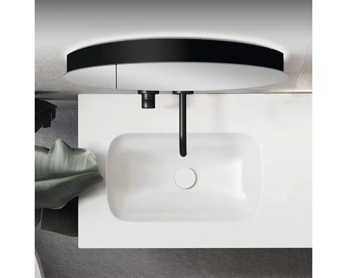 Afbeelding van een wastafel met kraan op een wastafelblad