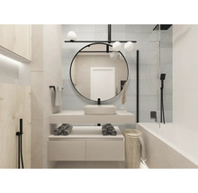 Moderne badkamer met wastafel, spiegel, bad en decoratieve tegels