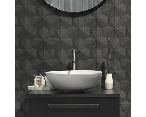 Moderne badkamer met geometrische wandtegels, wastafel en ronde spiegel