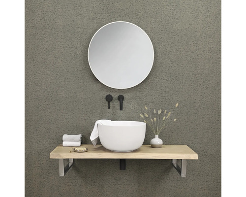 Moderne badkamer met ronde spiegel, opzetwastafel, wastafelblad en armaturen