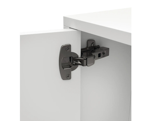 Scharnier bevestigd aan een wit meubelfront