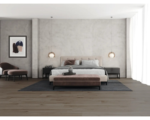 Slaapkamer met tweepersoonsbed, nachtkastjes, zitgelegenheid en hanglampen