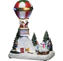 Decoratieve kerstscène met de kerstman in een luchtballon en spelende kinderen in de sneeuw.