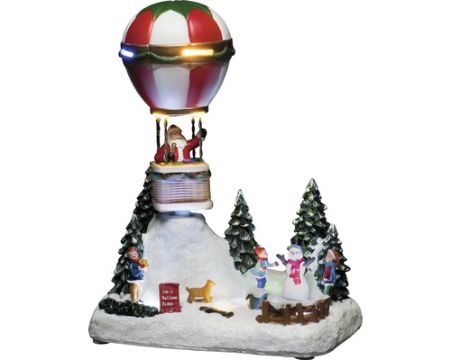 Decoratieve kerstscène met de kerstman in een luchtballon en spelende kinderen in de sneeuw.