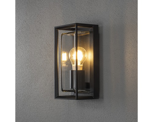 Rechthoekige wandlamp met gloeilamp in een metalen frame