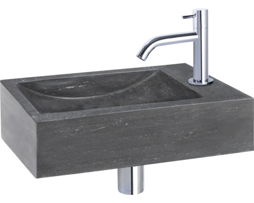 Wastafel van steen met kraan
