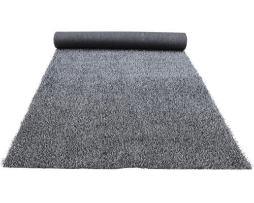 Grijze kunstgrasmat gedeeltelijk opgerold.