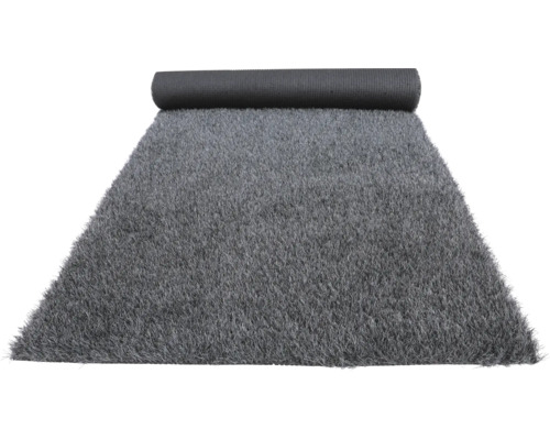 Grijs kunstgras gedeeltelijk opgerold