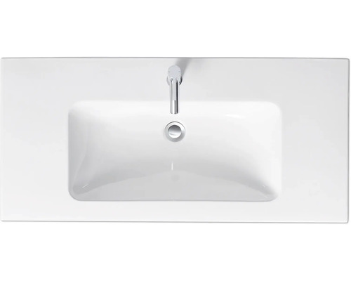 Bovenaanzicht van een wastafel met kraan en afvoerventiel