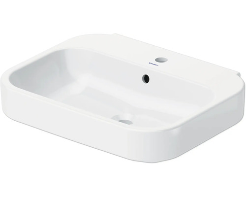 Witte wastafel met kraangat en overloop