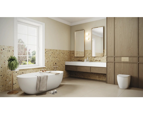 Lichte badkamer met bad, wastafels, spiegels en toilet