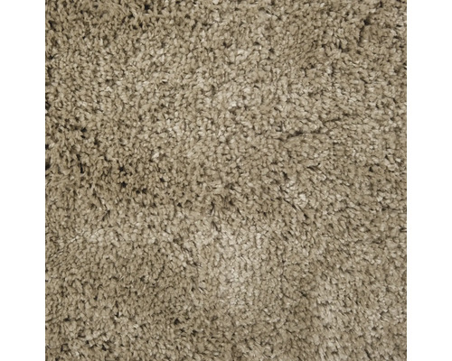 Close-up van een beige hoogpolig tapijt