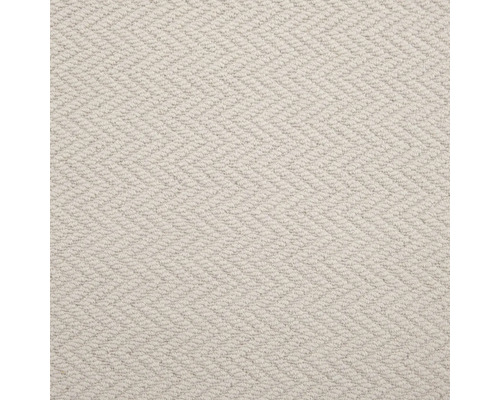 Detailopname van een lichtgekleurd tapijt met visgraatmotief.