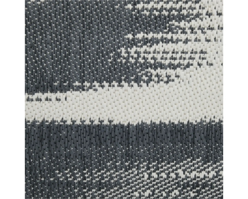 Close-up van een grijs en wit buitentapijt