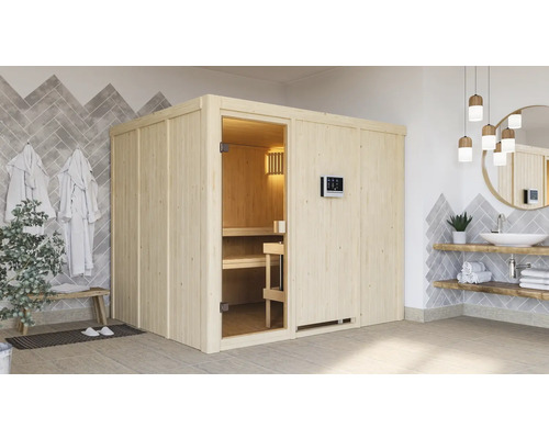 Sauna met houten wanden, glazen deur en digitaal bedieningspaneel in een badkamer met wastafel en handdoeken