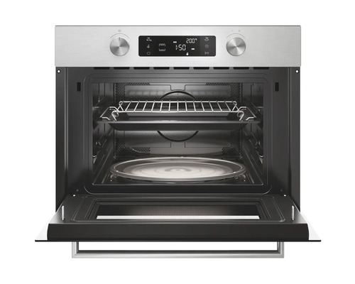 Geopende inbouwoven met grillrooster en draaiplateau