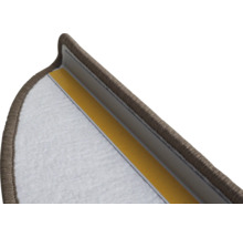 Detailopname van een trapmat met plakstrips voor bevestiging