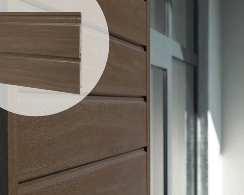 Close-up van een gevel met houten rabatdelen Close-up van een gevel met houten rabatdelen