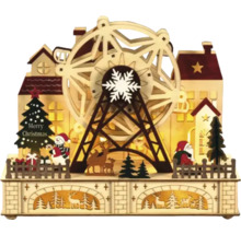 Kerstdecoratie met reuzenrad, huizen, kerstman, sneeuwpop, kerstboom en rendieren van hout