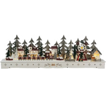 Kerstdecoratie met trein, huizen, kerstbomen en reuzenrad op een voetstuk