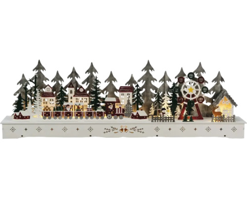 Kerstdecoratie met trein, huizen, kerstbomen en reuzenrad op een voetstuk
