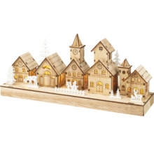Decoratieve houten winterdorpsscène met verlichting