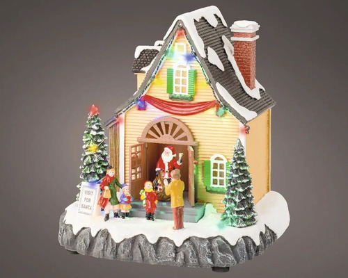 Kerstversiering verlicht huis met kerstman en kinderen