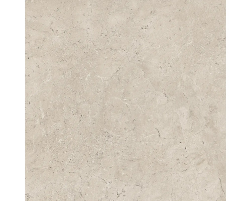 Close-up van een beige vloertegel met gemarmerde textuur
