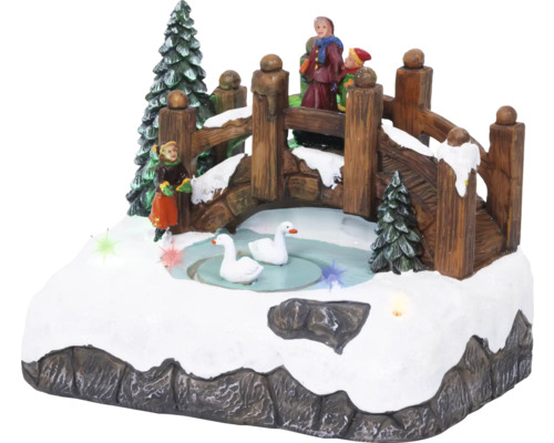 Decoratief winterlandschap met brug, figuren en zwanen voor een feestelijke sfeer