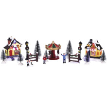 Kerstdorp scène met draaimolen, huizen, figuren en bomen