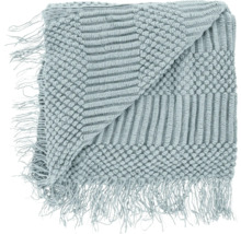 Opgevouwen sprei met franjes