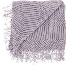Opgevouwen sprei met franjes