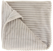 Opgevouwen fleece deken met ribbels