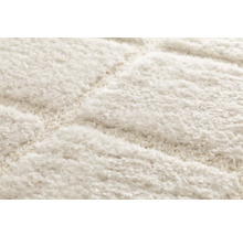 Detailweergave van een tapijt met een geometrisch patroon