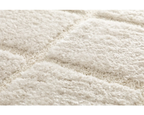 Detailweergave van een tapijt met een geometrisch patroon