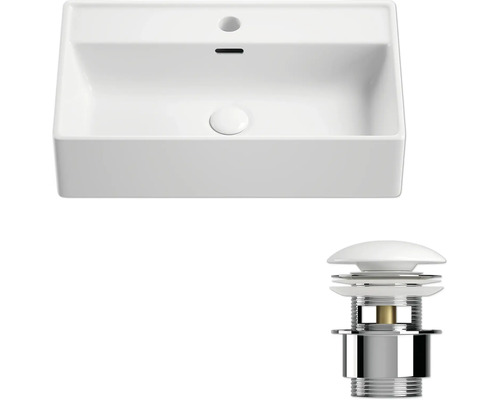 Bovenaanzicht van een wastafel met afvoergarnituur