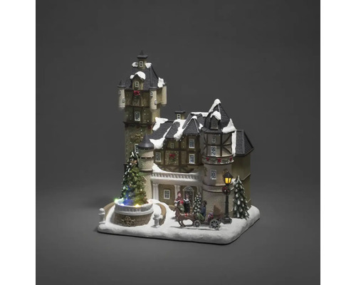 Decoratief kersttafereel met verlicht kasteel, figuren en paardenslee.