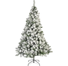 Sneeuw bedekte kunstmatige kerstboom op een standaard