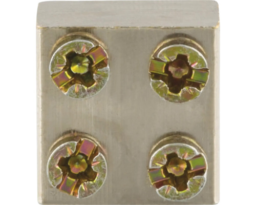 Detailopname van een meubelverbinding met vier schroeven